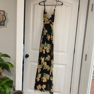 Fashion nova flowy black floral dress with cross in the black.